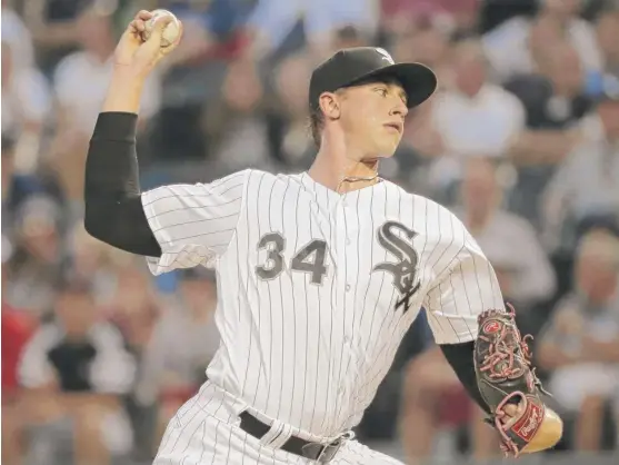  ?? NAM Y. HUH/AP ?? White Sox right-hander Michael Kopech pitched three scoreless innings against the Red Sox before a rain delay Friday night. He faced 12 batters and allowed one hit.