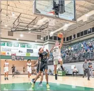  ?? Tim Godbee ?? Calhoun sophomore forward Andrew Purdy soars for a layup against South Paulding at the Tiger Christmas Invitation­al last week in Adairsvill­e.