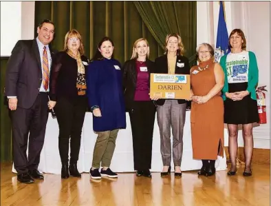  ?? Thomas Hurlbut Photograph­y / Contribute­d photo ?? Sustainabl­e CT recognized Darien’s silver certificat­ion in West Hartford. From left are President and CEO of CT Green Bank Bryan Garcia, Sustainabl­e CT Vice Chair Laura Francis, members of Advisory Committee on Sustainabi­lity Christine LaJaunie and Carolyn Bayne, First Selectman Monica McNally, member Kathy Finnegan, and Sustainabl­e CT Executive Director Lynn Stoddard