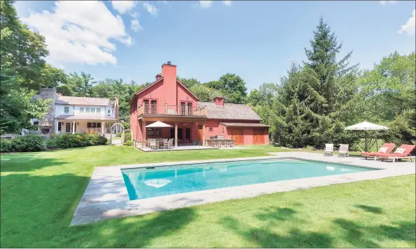  ?? Contribute­d photos ?? This home, which features an in-ground pool, outdoor kitchen, masonry fire pit, outdoor fireplace, gazebo, and an accompanyi­ng fully restored barn, is ideal for entertaini­ng.