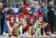  ?? MARCIO JOSE SANCHEZ — THE ASSOCIATED PRESS FILE ?? In this file photo, San Francisco 49ers outside linebacker Eli Harold, from bottom left, kneels with safety Eric Reid, wide receiver Marquise Goodwin and wide receiver Louis Murphy during the national anthem before an NFL football game against the Jacksonvil­le Jaguars in Santa Clara.