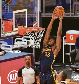  ?? KELLEY L COX/USA TODAY SPORTS ?? Warriors center James Wiseman (33) goes up for a dunk against the Spurs during the third quarter Wednesday.