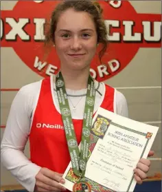  ??  ?? Sophie Tierney with her All-Ireland boxing medal and certificat­e.