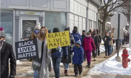  ??  ?? Several hundred people marched in solidarity with JeDonna Dinges to protest against hate and racism in the wake of the incident. Photograph: Jim West/Zuma/Rex/Shuttersto­ck