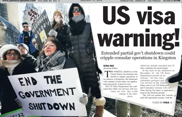  ??  ?? United States Government workers and their supporters hold signs during a protest in Boston, last Friday.