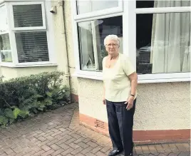  ??  ?? Delighted Mrs Coyle, of Paisley, is more than happy with her new windows