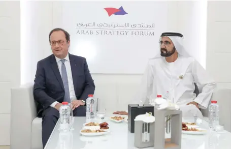  ??  ?? Sheikh Mohammed bin Rashid, Vice President and Ruler of Dubai, with the former French president Francois Hollande, at the Arab Strategy Forum in Dubai yesterday. Former US defence secretary Robert Gates was also in attendance Wam