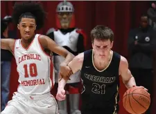  ?? CHRIS CHRISTO — BOSTON HERALD ?? Catholic Memorial’s Aiden Pires, left, defends against Needham’s Jackson Shaw during CM’s 81-64 boys basketball win Tuesday.