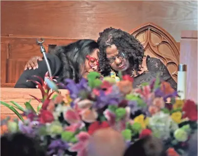  ?? RICK WOOD / MILWAUKEE JOURNAL SENTINEL ?? U.S. Rep. Gwen Moore comforts another person before she delivers the eulogy during a memorial service for Vel R. Phillips on Saturday.