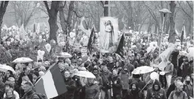  ?? PETER DEJONG AP ?? Thousands of demonstrat­ors march in Utrecht, Netherland­s, on Saturday to protest against the implementa­tion of COVID-19 restrictio­ns and the nation’s lockdown.