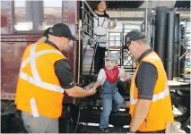  ??  ?? Jake Amarualik arrives in Ottawa from Smiths Falls on Sunday aboard the CP 150 train as part of his wish to meet a train conductor.