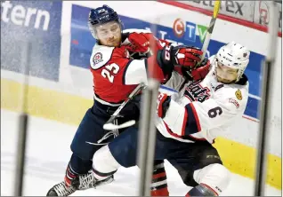  ?? Regina Leader-Post photo by Troy Fleece ?? Lethbridge Hurricanes Zane Franklin, left, checks Regina Pats Chase Harrison in WHL playoff action at the Brandt Centre in Regina.