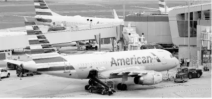  ?? AP ?? American Airlines planes sit on the tarmac at Terminal B at LaGuardia Airport on January 11, 2023, in New York.