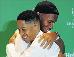  ?? Picture: Alon Skuy ?? Soccer legends Didier Drogba, left, and Steven Pienaar embrace.