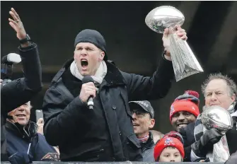  ??  ?? Patriots quarterbac­k Tom Brady addresses the crowd along during a rally Tuesday in Boston to celebrate New England’s win over the Atlanta Falcons in the Super Bowl 51.