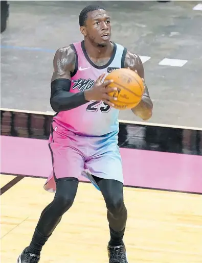  ?? MARTA LAVANDIER/AP ?? Heat guard Kendrick Nunn aims for a basket against the Knicks on Feb. 9 in Miami.