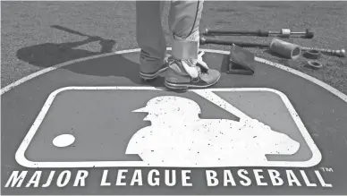  ??  ?? Second baseman Jason Kipnis stands on the MLB logo in 2013 in Chicago.