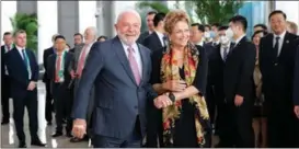  ?? GAO FENG / XINHUA ?? Brazilian President Luiz Inacio Lula da Silva shakes hands with Dilma Vana Rousseff, the newly elected president of the New Developmen­t Bank, on April 13, during her inaugurati­on in Shanghai.