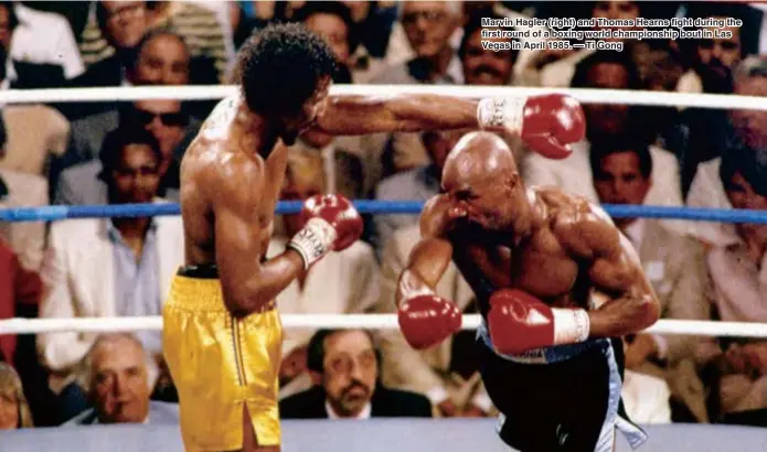  ??  ?? Marvin Hagler (right) and Thomas Hearns fight during the first round of a boxing world championsh­ip bout in Las Vegas in April 1985. — Ti Gong