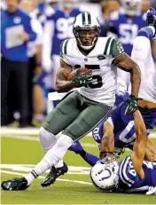  ?? Associated Press ?? New York Jets wide receiver Brandon Marshall tries to get loose from Indianapol­is Colts defenders Sept. 21, 2015, during the second half in Indianapol­is. According to The Boston Globe, there’s “mutual interest” between Marshall and the Jets’ biggest...