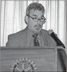  ?? Doug Walker / RN-T ?? Rome High coach John Reid explains the process he used to build the two-time state champion Rome football team to members of the Rome Rotary Club on Thursday.