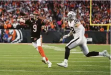  ?? Jeff Dean / Associated Press ?? Cincinnati quarterbac­k Joe Burrow (9) threw for 244 yards and two touchdowns, including one disputed by the Raiders.