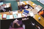  ?? LINCOLN COUNTY DISTRICT COURT/THE OKLAHOMAN ?? In an image taken from security camera video, Lincoln County District Judge Traci Soderstrom looks at her cellphone during a murder trial in June at the Lincoln County District Court in Chandler, Okla.