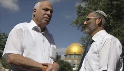  ?? (Oren Nahshon/Flash90) ?? LAWMAKERS URI ARIEL (left) and Michael Ben-Ari, both representi­ng the now defunct National Union party, visit the Temple Mount in May 2012.