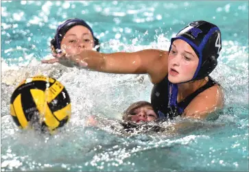  ?? RECORDER PHOTO BY CHIEKO HARA ?? Monache High School’s Ava Lobue, right, attempts to steal a ball Friday, during the second half of a game against Redwood High School in a quarterfin­al match of the CIF Central Section Division II playoffs at Monache High School. GIRLS WATER POLO PLAYOFFS