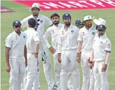  ?? — AFP ?? Indian cricketers look on as West Indies cricketer Kraigg Brathwaite walks off the field during day three of the first Test against West Indies at Sir Vivian Richards Stadium in St John’s, Antigua.
