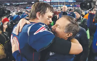  ?? TRUE HERO: Patriots quarterbac­k Tom Brady celebrates with coach Bill Belichick after winning the AFC Championsh­ip. ??