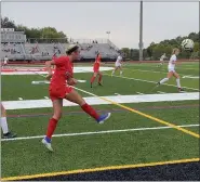  ?? MIKE CABREY/MEDIANEWS GROUP ?? Souderton’s Averie Doughty (21) watches the ball after sending it up the field during the Indians’ game against Central Bucks East on Thursday.