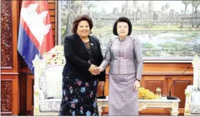  ?? NA ?? National Assembly president Khuon Sudary (right) shakes hands with outgoing Cuban ambassador to Cambodia Liurka Rodriguez Barrios on January 10.
