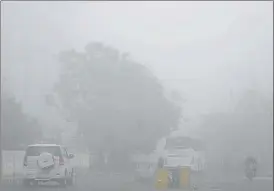  ?? SUNIL GHOSH/HT PHOTO ?? Commuters on a foggy morning in Noida on Saturday. In February this year, Noida has seen 15 days of ‘very poor’ air quality so far and one day of ‘severe’ air quality.