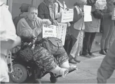  ?? SCOTT OLSON, GETTY IMAGES ?? Demonstrat­ors protest proposed changes to the Affordable Care Act on Wednesday in Chicago.