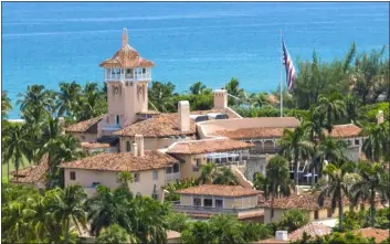  ?? STEVE HELBER — THE ASSOCIATED PRESS FILE ?? This photo shows an aerial view of former President Donald Trump’s Mar-a-lago club in Palm Beach, Fla., Aug. 31. The FBI search of Donald Trump’s Florida estate has spawned a parallel special master process that this month slowed down a criminal investigat­ion and exposed simmering tensions between Justice Department prosecutor­s and lawyers for the former president. The probe into the presence of top-secret informatio­n at Mar-alago continues.