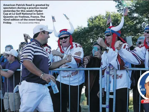  ?? — THE ASSOCIATED PRESS ?? American Patrick Reed is greeted by spectators during a practice round yesterday for this week’s Ryder Cup at Le Golf National in SaintQuent­in-en-Yvelines, France. The 42nd edition of the event begins Friday.