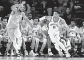  ?? WADE PAYNE AP ?? Vanderbilt’s Tyrin Lawrence drives against Tennessee’s Josiah-Jordan James in the second half.