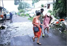  ?? Picture: REUTERS ?? VACATING THEIR HOMES: People flee as floodwater­s rise from Hurricane Maria in BasseTerre on Guadeloupe Island.