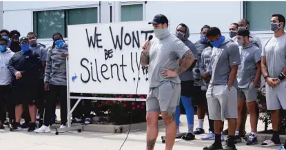  ?? CARLOS OSORIO/AP ?? Lions tackle Taylor Decker addresses reporters Tuesday after the team became the first NFL team to openly protest.