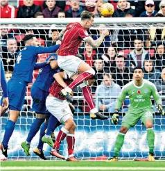  ??  ?? Power play: Aden Flint delivers a thumping header to score the winner for Bristol City