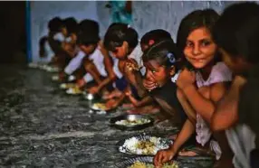  ?? REUTERS PIC ?? The 2018 SDG Index and Dashboards Report shows that no country is on track to achieve all goals by 2030, including ending poverty and hunger, promoting good education, health and wellbeing.
