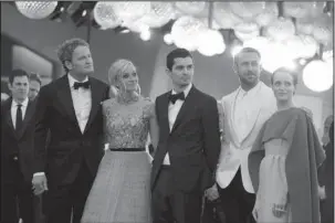  ?? The Associated Press ?? CHAZELLE: Actors Jason Clarke, from left, Olivia Hamilton, director Damien Chazelle, actors Ryan Gosling and Claire Foy pose for photograph­ers upon arrival on Aug. 29 at the premiere of the film 'First Man' and the opening ceremony of the 75th edition of the Venice Film Festival in Venice, Italy.