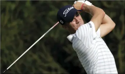  ??  ?? In this Aug. 23 file photo, Justin Thomas tees off on the 14th hole during the first round of the Northern Trust golf tournament in Paramus, N.J. Tiger Woods finished off the PGA Tour season by tapping in for par to win the Tour Championsh­ip, a moment that ended any doubts that he could win again after four surgeries on his lower back. AP PHOTO/JULIO CORTEZ