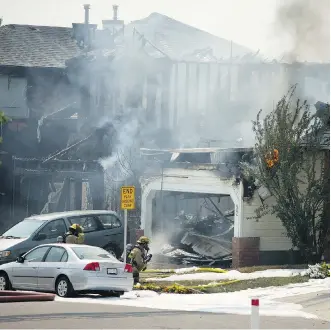  ??  ?? A renter in a house that was destroyed by the blaze alerted his neighbours by cellphone after leaving his burning home. Everyone escaped uninjured. The renter said he is now homeless.