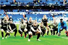  ??  ?? Ajax’s players celebrate at the end of the UEFA Champions League round of 16 second leg football match between Real Madrid CF and Ajax at the Santiago Bernabeu stadium in Madrid. - AFP photo