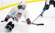  ?? RICARDO RAMIREZ BUXEDA/STAFF PHOTOGRAPH­ER ?? Chris Douglas, with spina bifida, practices at The Ice Factory: “It is just nothing but sled hockey until I get a gold medal.’’