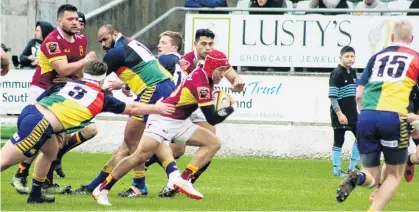  ?? PHOTO: LOGAN SAVORY ?? Busting through . . . Southland Spartans fullback Lisala Halaleva on his way to score in the Spartans’ 4438 victory over the Otago Sassenachs at Rugby Park in Invercargi­ll yesterday.