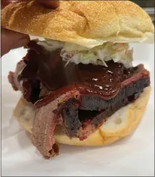  ?? SUBMITTED PHOTO ?? This photo shows a brisket sandwich with slaw that was featured as a special at Spring City’s Curley’s ‘Que, owned by Mark Van Horn.