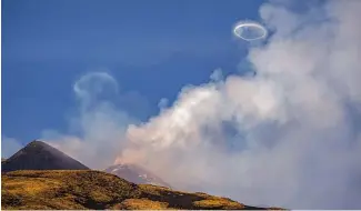  ?? ?? Volcanic vortex rings emerge from a new pit crater on the north side of the southeast crater of the Etna Volcano in Sicily, Italy, 5 April 2024.